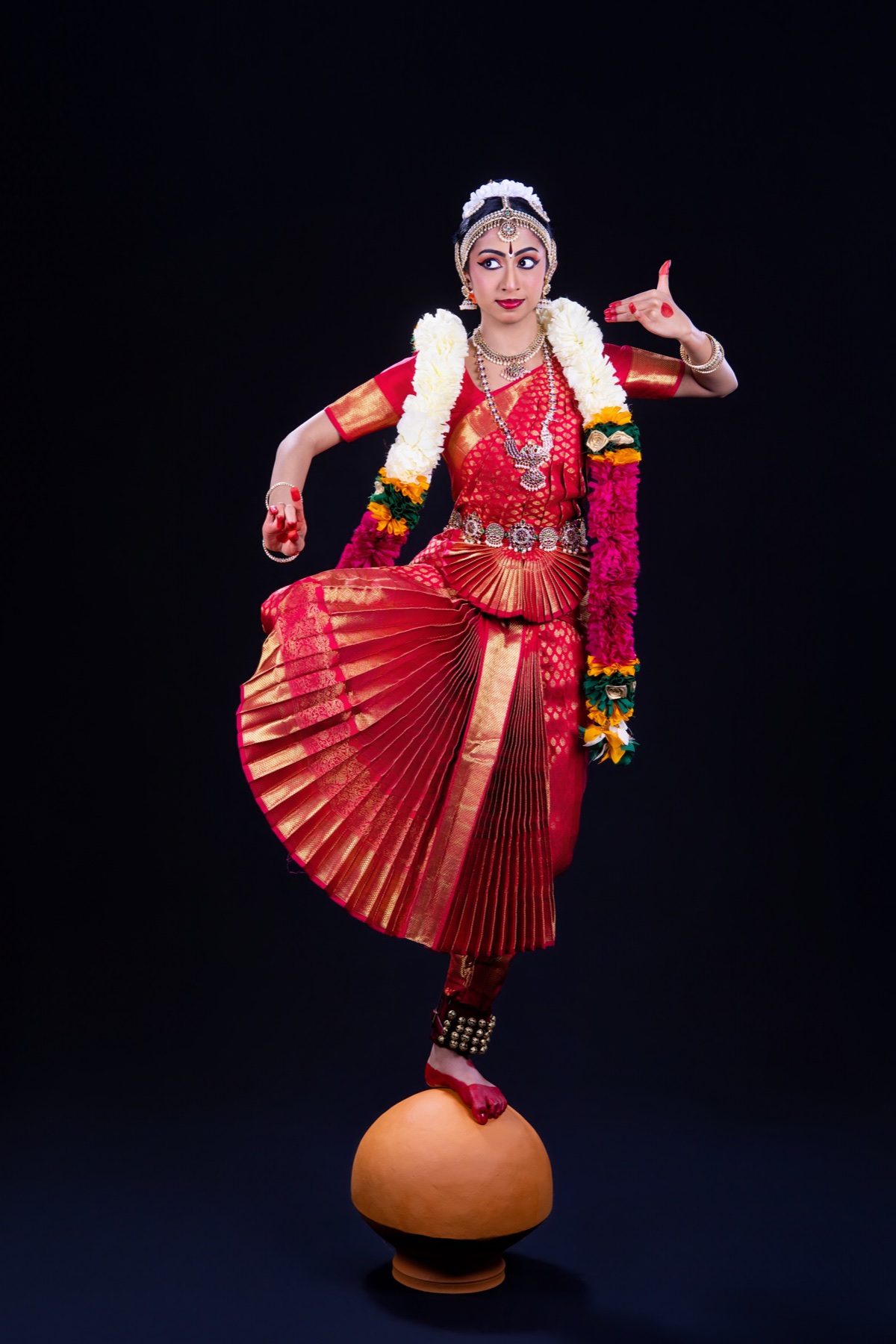 Aadhya balancing in a classical Bharatanatyam pose